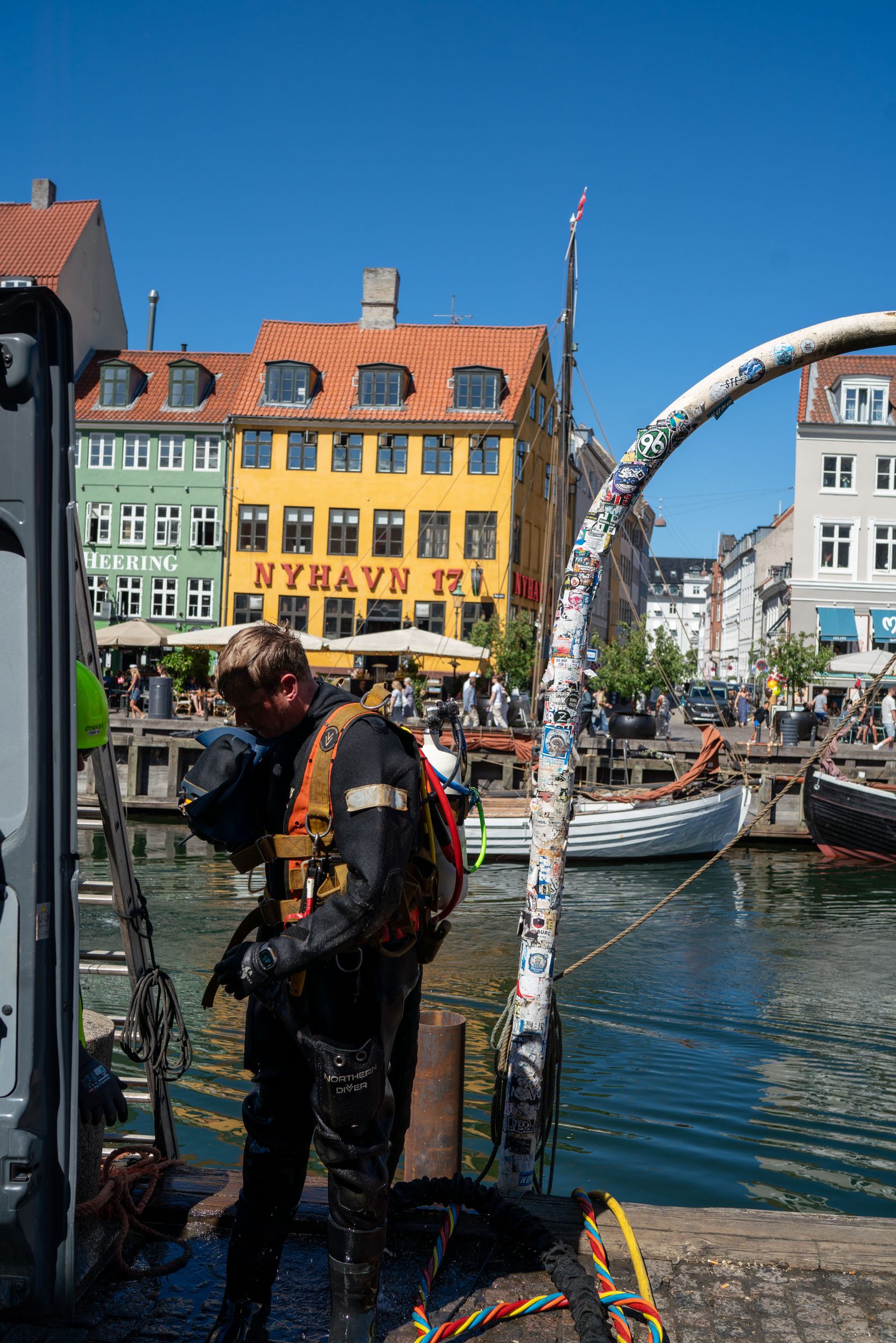 Commercial diver in helmet and suit ready for underwater work