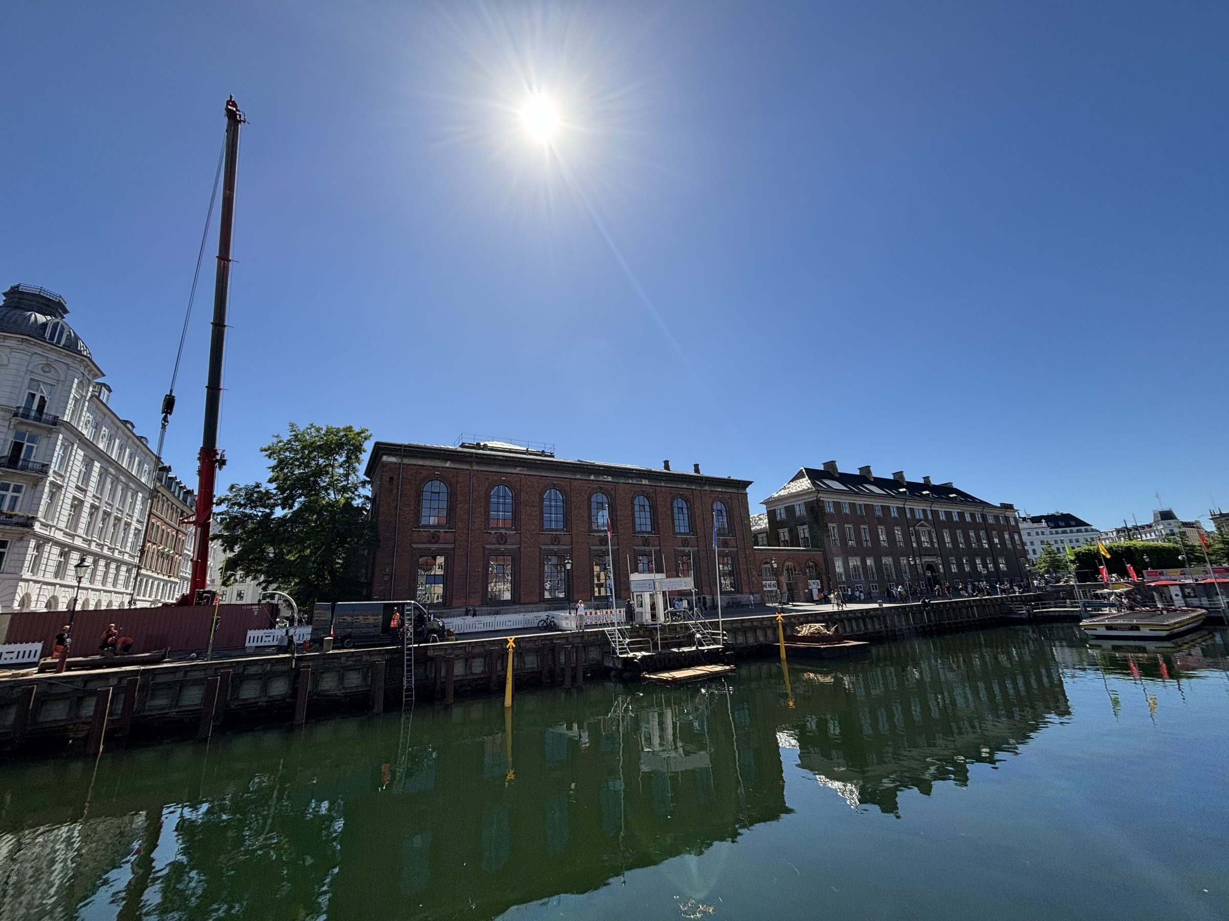Worksite with crane and quay structures in Nyhavn